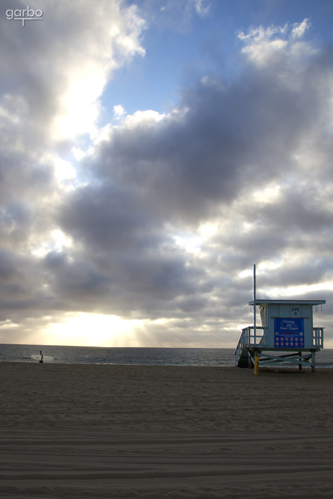 lifeguard tower and surfer